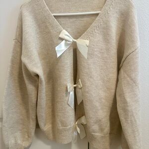 Elegant Cream Sweater with Bow Accents
